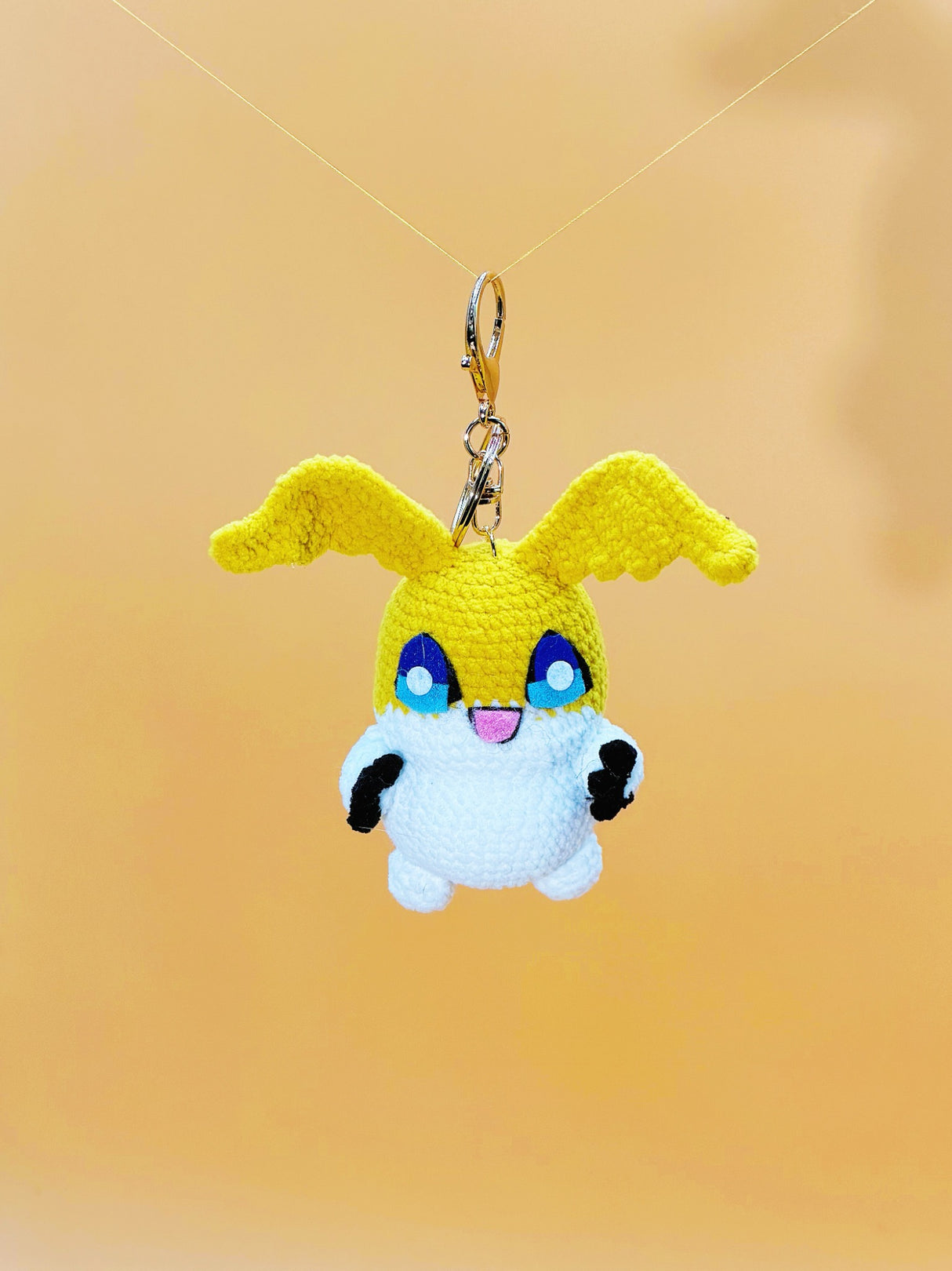 Yellow winged monster handmade crochet keychain