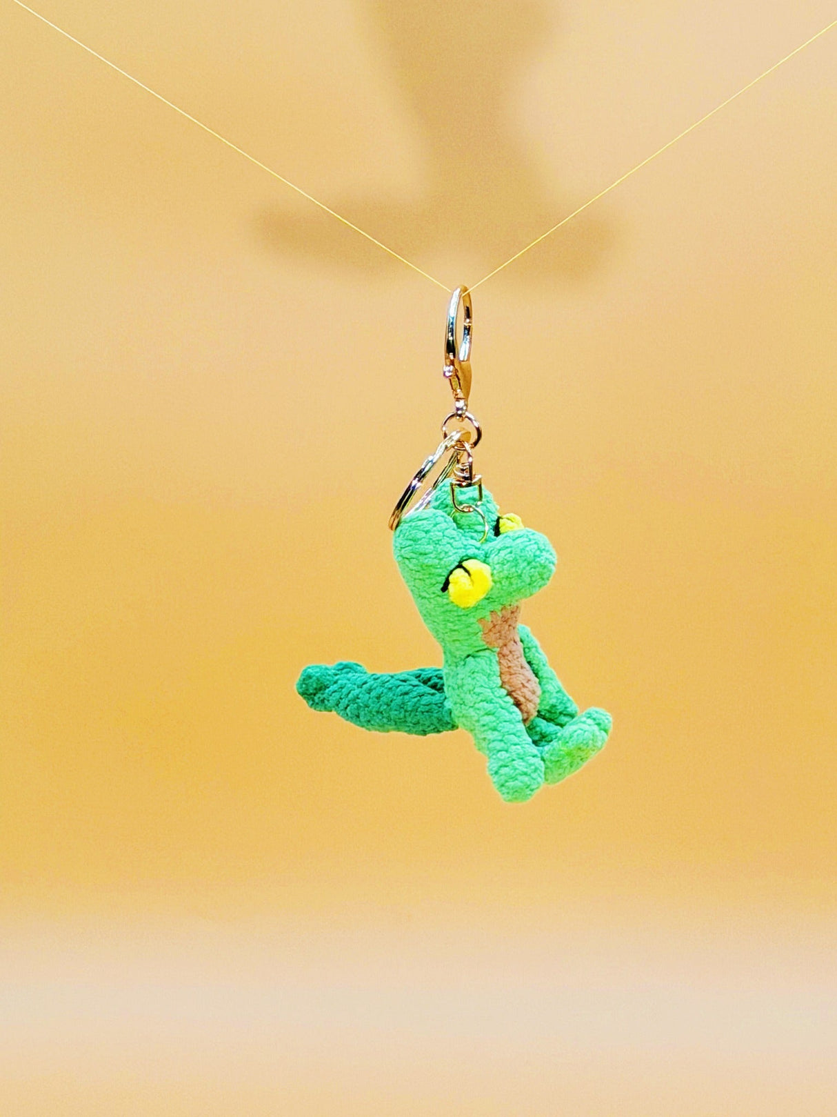 Green gecko handmade crochet keychain side view