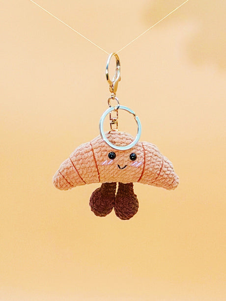 Smiling croissant handmade crochet keychain