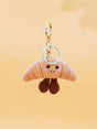 Smiling croissant handmade crochet keychain